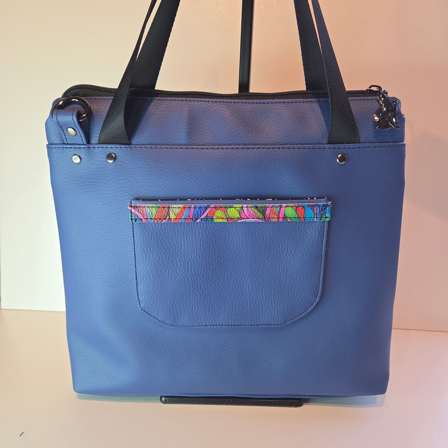Blue tote bag with colourful pocket trim