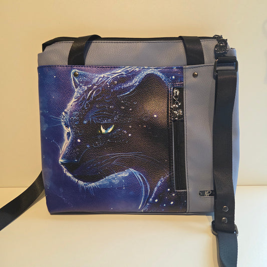 Pale blue bag featuring a ethereal panther on a starry background