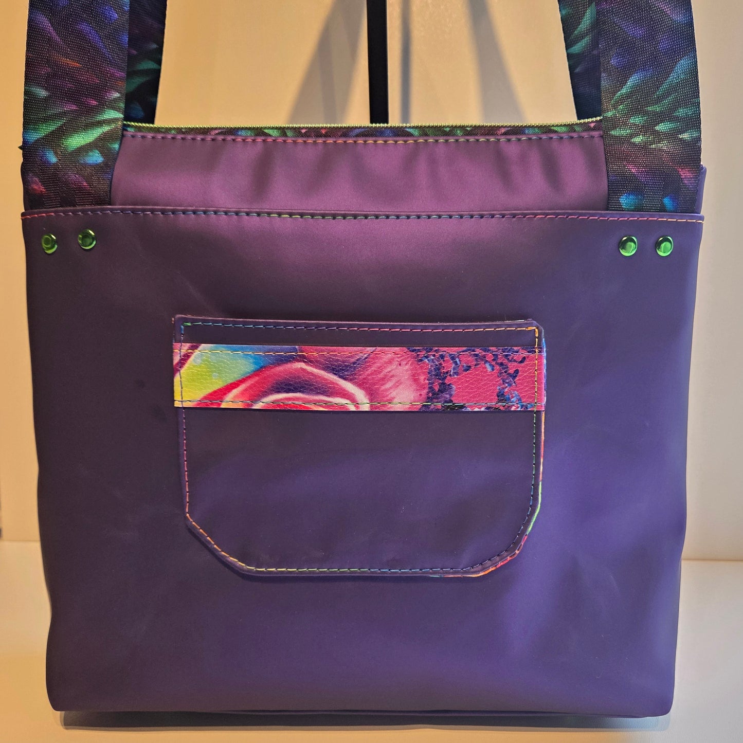 back view of a purple tote bag with pocket detail